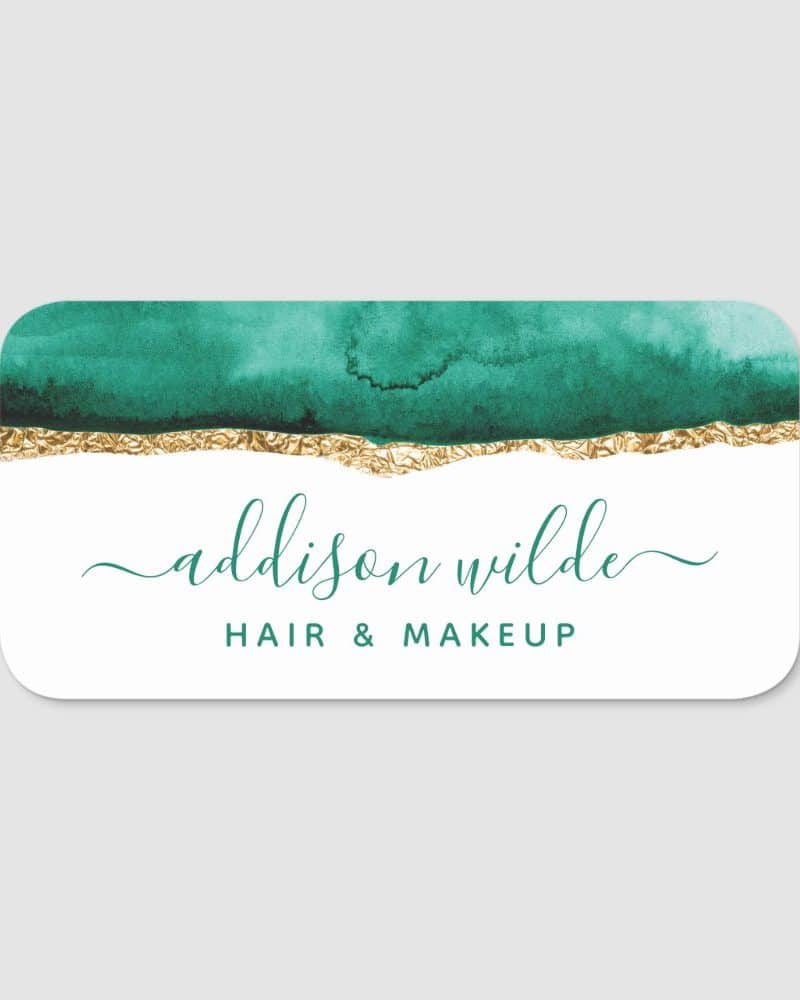 Business card featuring a teal watercolor wash accented with gold foil, and the name Addison Wilde, Hair & Makeup.
