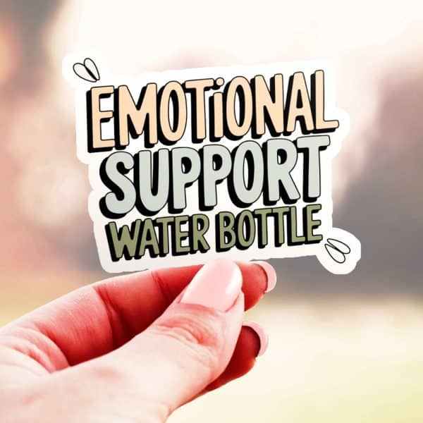 A Hand Holds Up A Sticker That Reads Emotional Support Water Bottle. The Text Is Stylized In Pastel Colors.