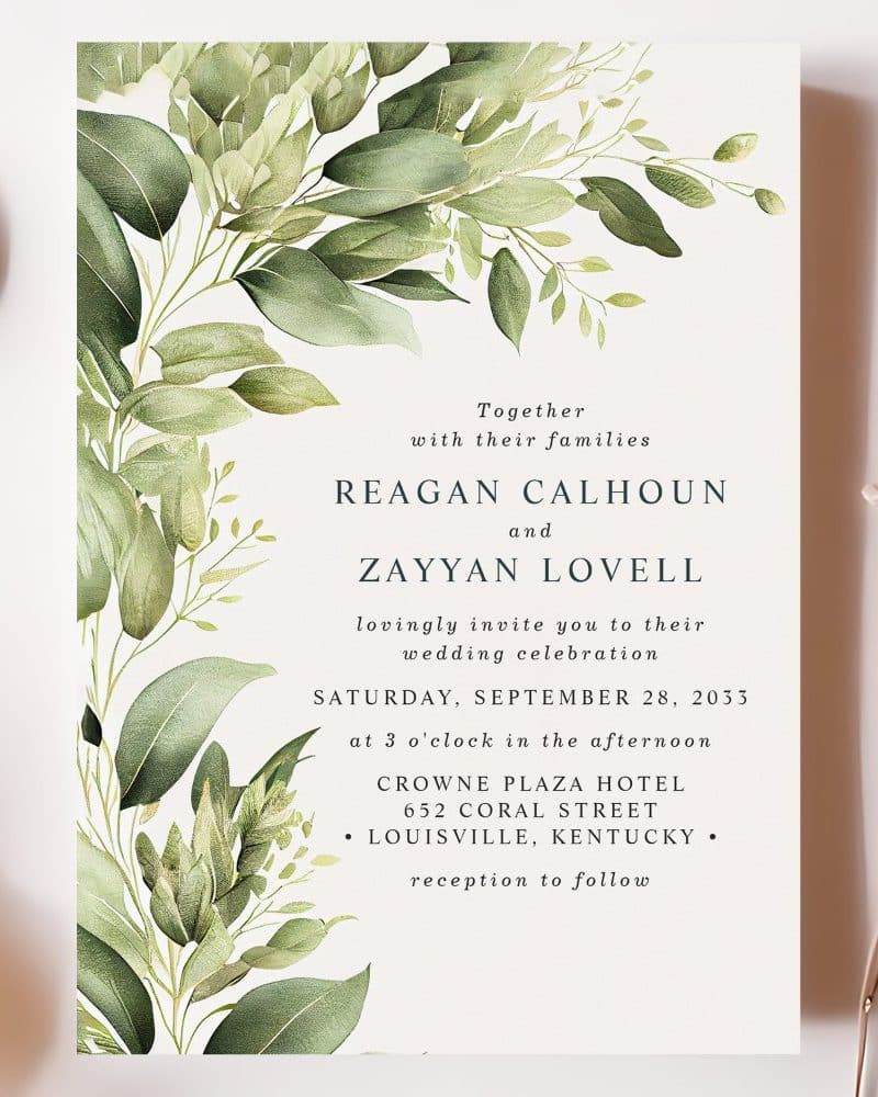 Wedding invitation with green watercolor floral design, announcing the marriage of Reagan Calhoun and Zayyan Lovell.