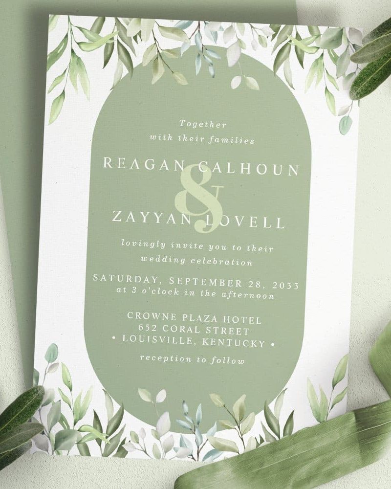 Sage green wedding invitation with watercolor greenery border, announcing the marriage of Reagan Calhoun and Zayyan Lovell.