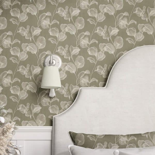 A Curved Headboard With A Matching Pillow Sits Against A Wall Covered In Olive Green Wallpaper Featuring A Pattern Of Translucent White Leaves.