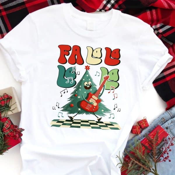 White T-Shirt Featuring A Cartoon Christmas Tree Playing An Electric Guitar; &Quot;Fa La La La La&Quot; Text Surrounds The Tree.