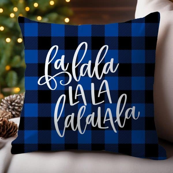 Blue And Black Buffalo Plaid Throw Pillow With The Words &Quot;Fa La La La La La La&Quot; In White Script.