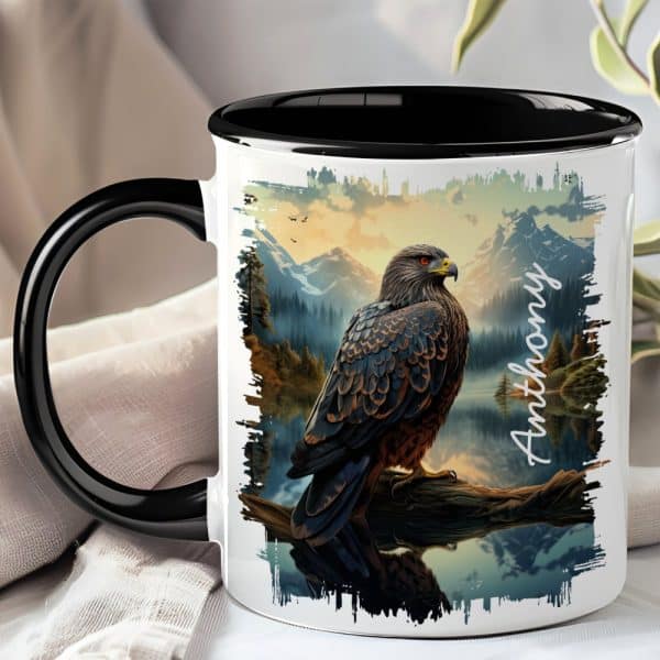 Black-Handled Mug With A Personalized Design Featuring A Hawk Perched On A Branch Overlooking A Mountain Lake At Sunset.