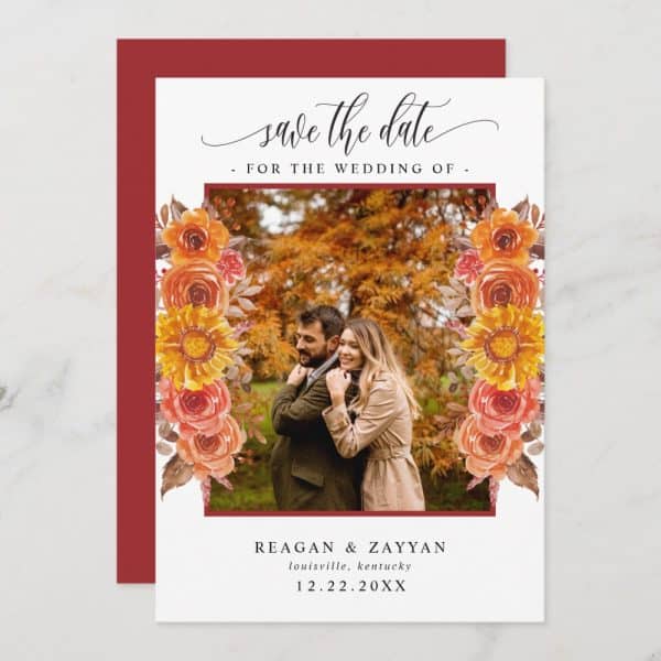 Save The Date Card With A Photo Of A Couple Embracing, Framed By Autumnal Flowers.