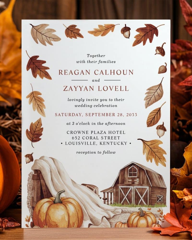 Fall-themed wedding invitation for Reagan Calhoun and Zayyan Lovell, featuring a barn and pumpkins.