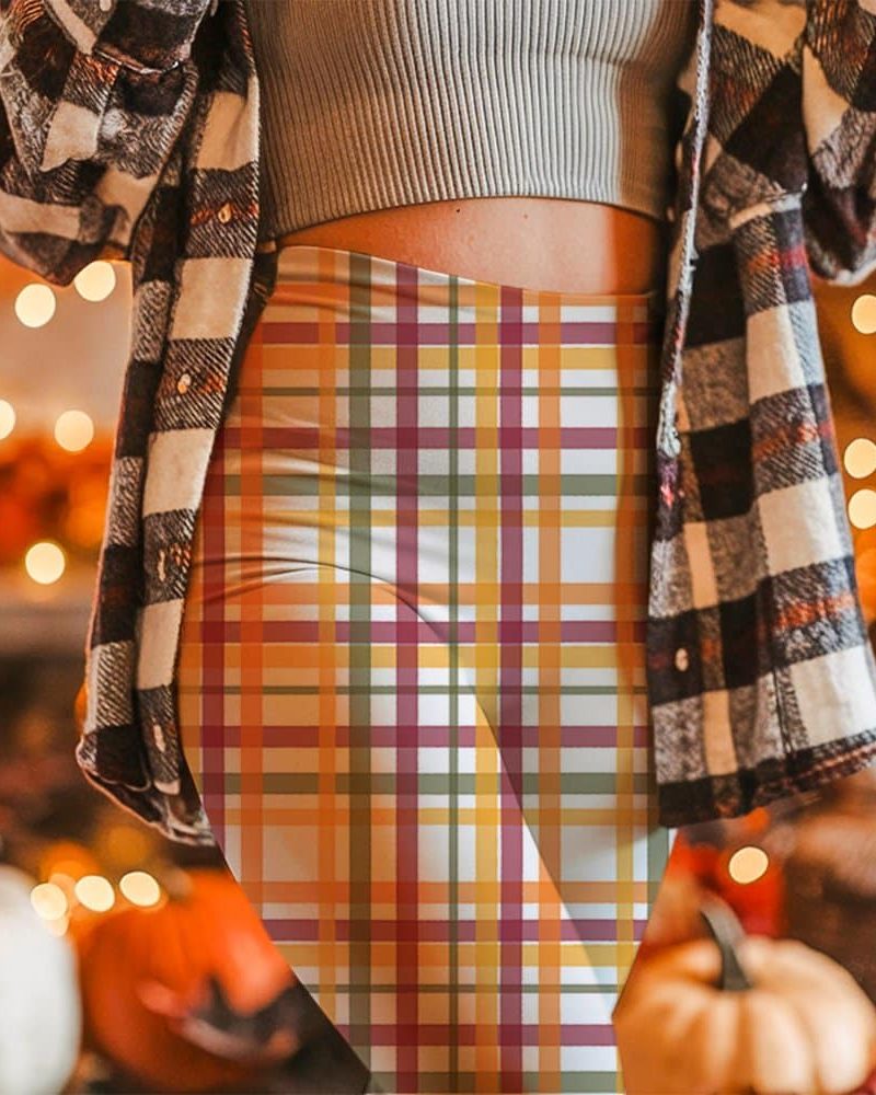 Woman wearing fall-colored plaid leggings.