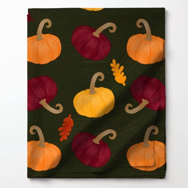 Dark Green Fabric With A Repeating Pattern Of Orange, Yellow, And Maroon Pumpkins And Autumn Leaves.