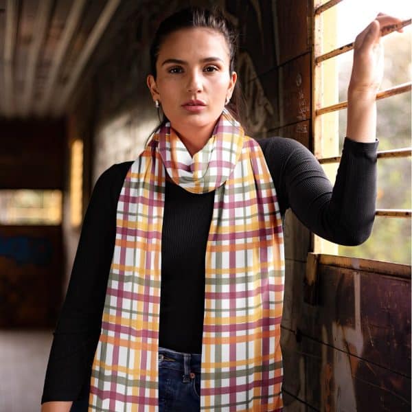 Woman Wearing A Long, Plaid Scarf In Autumnal Colors.