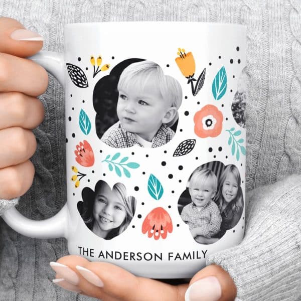 White Coffee Mug Featuring Black And White Family Photos Surrounded By A Floral Design. The Andersons Family Name Is Printed At The Bottom.
