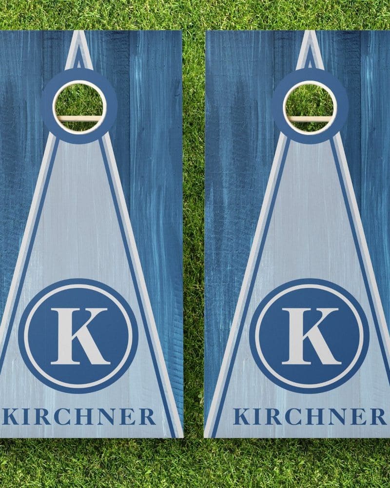 Pair of blue and gray cornhole boards with the initial K and the last name Kirchner.