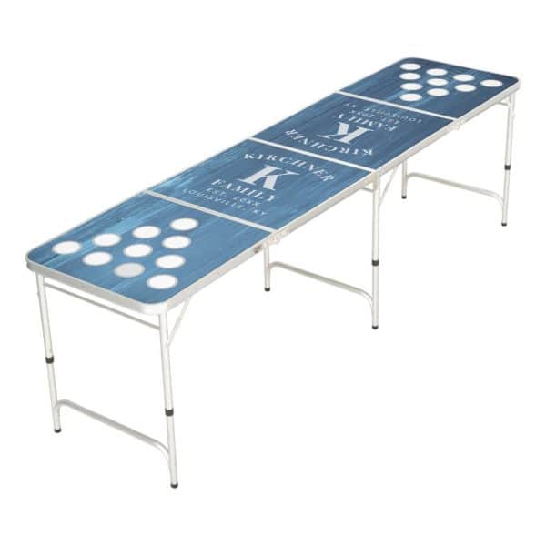 Blue Cornhole Table With A Personalized Family Name And Initial.