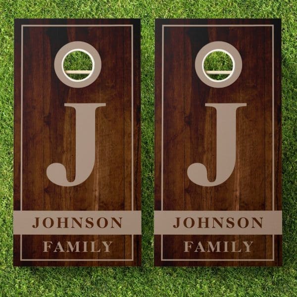 Pair Of Dark Brown Wooden Cornhole Boards With The Letter J And Johnson Family.