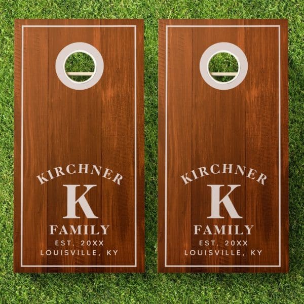 Pair Of Brown Wooden Cornhole Boards, Each Personalized With The Kirchner Family Name, Initial K, Establishment Year, And Location.