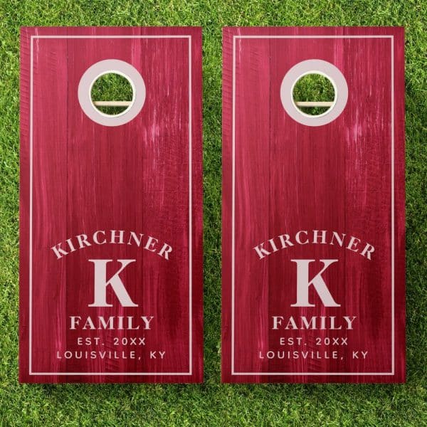 Pair Of Red Personalized Cornhole Boards With The Kirchner Family Name And Initial K.