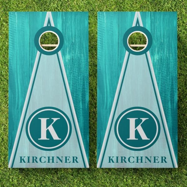 Pair Of Teal And Light Blue Personalized Cornhole Boards With The Initial K And The Last Name Kirchner.