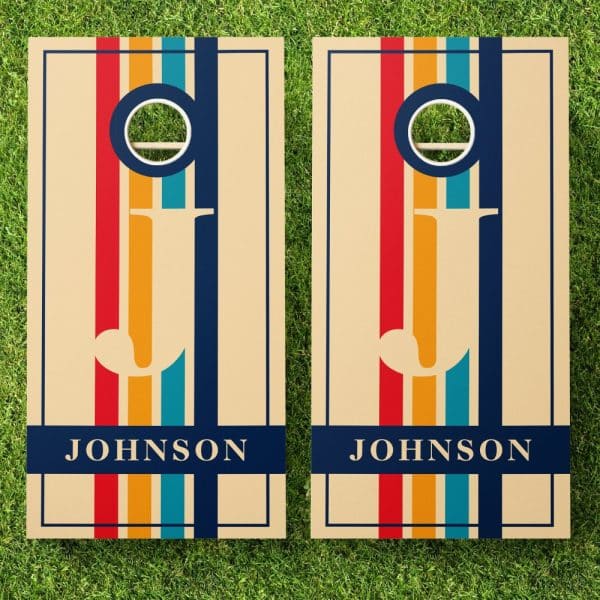 Pair Of Personalized Beige Cornhole Boards With A Retro Striped Design, The Name Johnson At The Bottom.