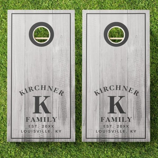 Pair Of Gray Wooden Cornhole Boards With The Kirchner Family Name, Initial K, Establishment Year, And City.