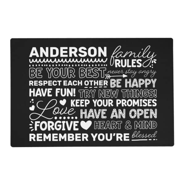 Black Rectangular Sign With White Text Stating The Anderson Family Rules: Be Your Best, Respect Each Other, Be Happy, Have Fun, Try New Things, Keep Your Promises, Love, Have An Open Heart And Mind, Forgive, And Remember You'Re Blessed.