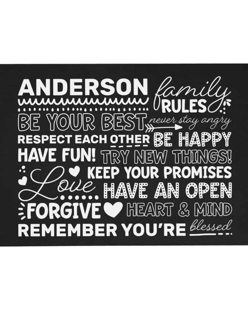 Black rectangular sign with white text stating the Anderson family rules: be your best, respect each other, be happy, have fun, try new things, keep your promises, love, have an open heart and mind, forgive, and remember you're blessed.
