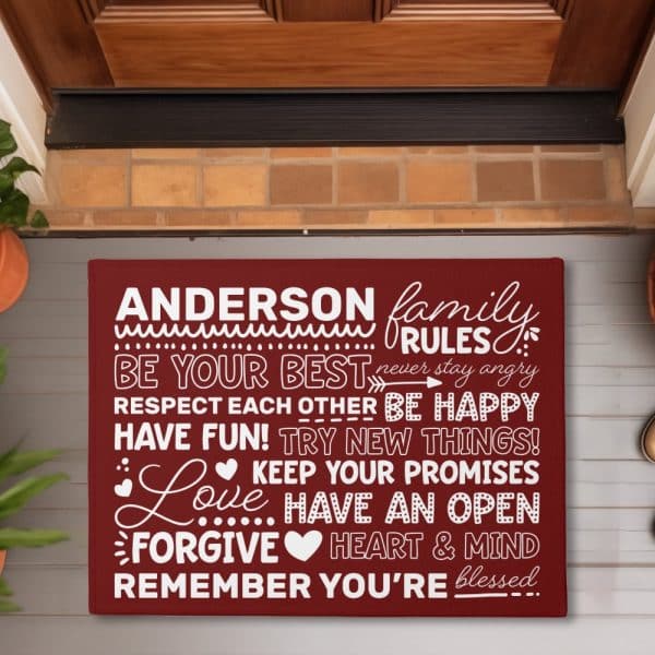 A Maroon Doormat With The Anderson Family Rules, Including Being Your Best, Respecting Each Other, And Keeping Your Promises.
