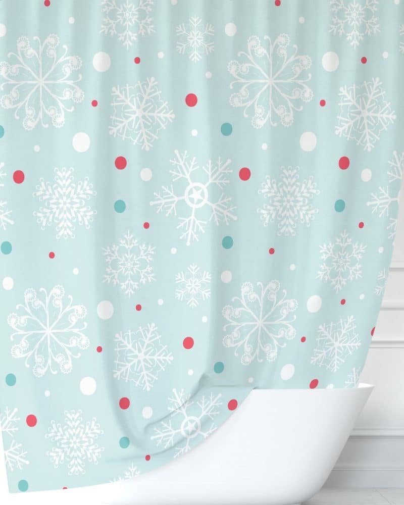 Light blue shower curtain with a snowflake and polka dot pattern.