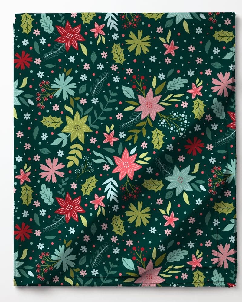 Dark green fabric with a repeating pattern of colorful flowers and leaves.