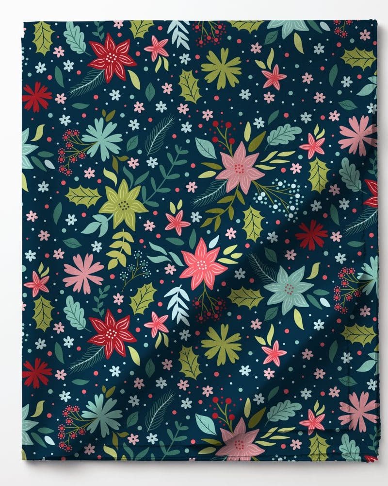 Dark blue fabric with a repeating pattern of colorful flowers and leaves.
