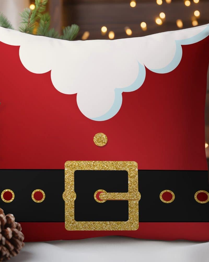 Red throw pillow depicting Santas belt and coat.