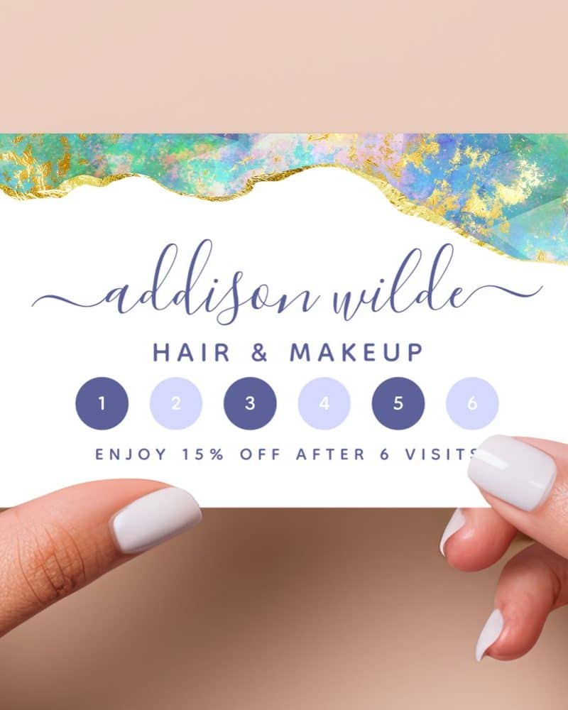 A six-visit loyalty card for Addison Wilde Hair & Makeup, featuring an abstract design with gold accents.
