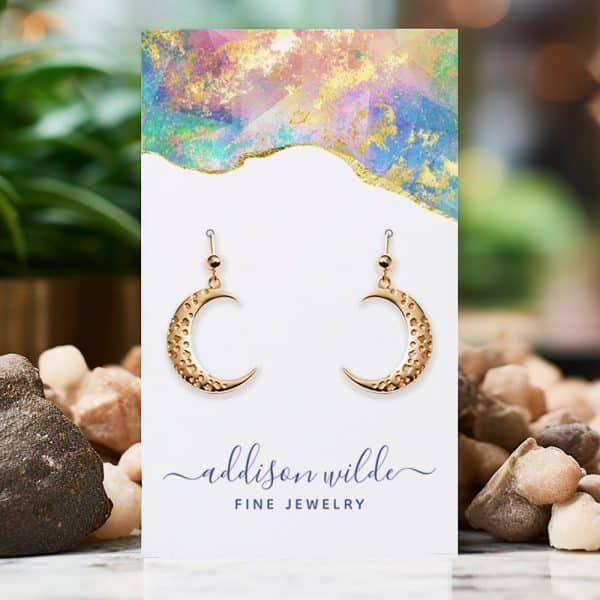 Gold Crescent Moon Earrings Displayed On A Jewelry Card.