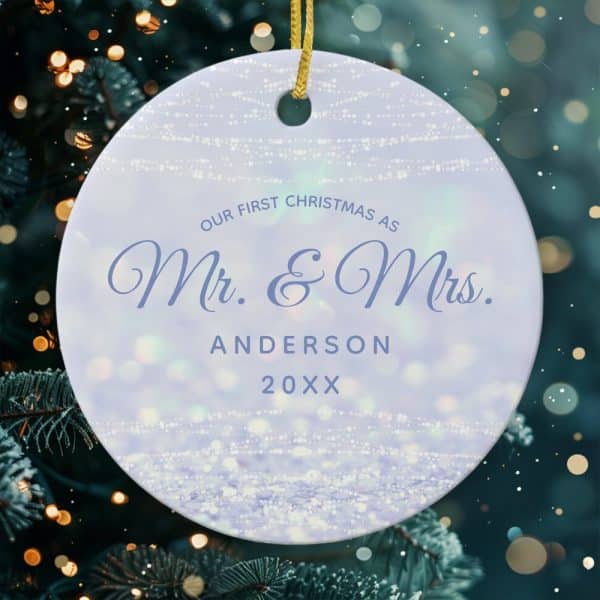 Round Christmas Ornament With A Lavender Background, Light Sparkle Design, And Text That Reads &Quot;Our First Christmas As Mr. &Amp; Mrs. Anderson 20Xx&Quot;.