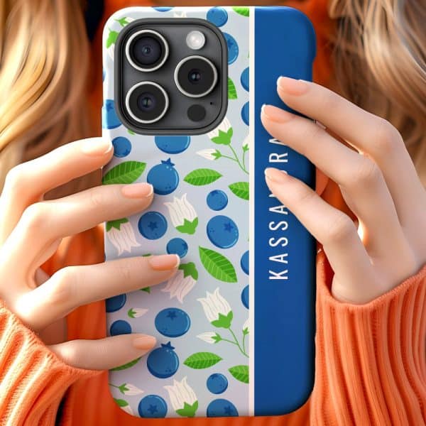 Woman'S Hands Holding A Phone Case With A Blueberry Pattern And A Blue Vertical Stripe With A Name.