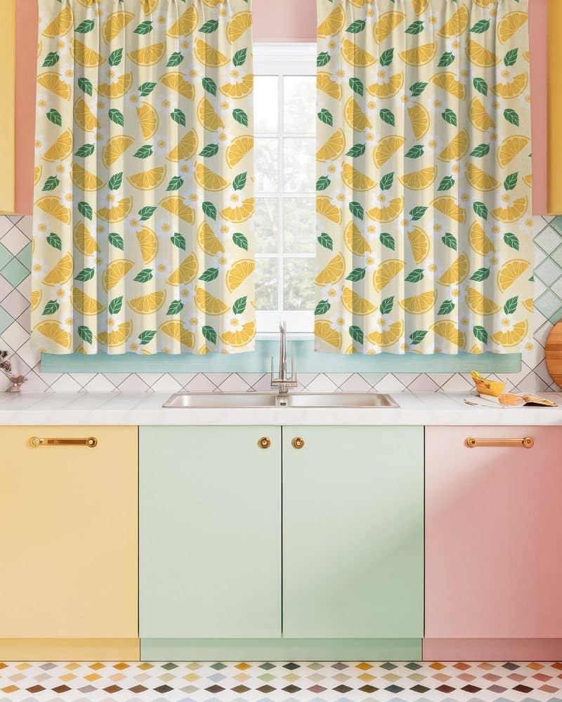 Lemon-print kitchen curtains hanging in a window.