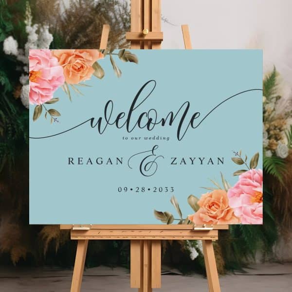 Light Blue Wedding Welcome Sign With Floral Corners And The Names Reagan And Zayyan, And The Date September 28, 2033.