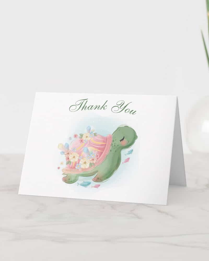 Thank you card featuring an illustration of a sea turtle with flowers on its shell.