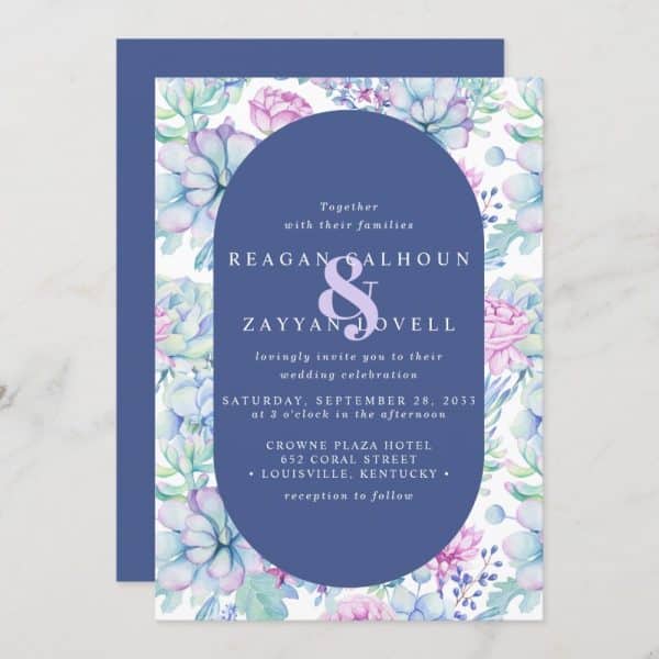 Wedding Invitation With Watercolor Succulents And Flowers; Reagan Calhoun And Zayyan Lovell'S Names And Wedding Details Are Featured On A Navy Blue Oval.