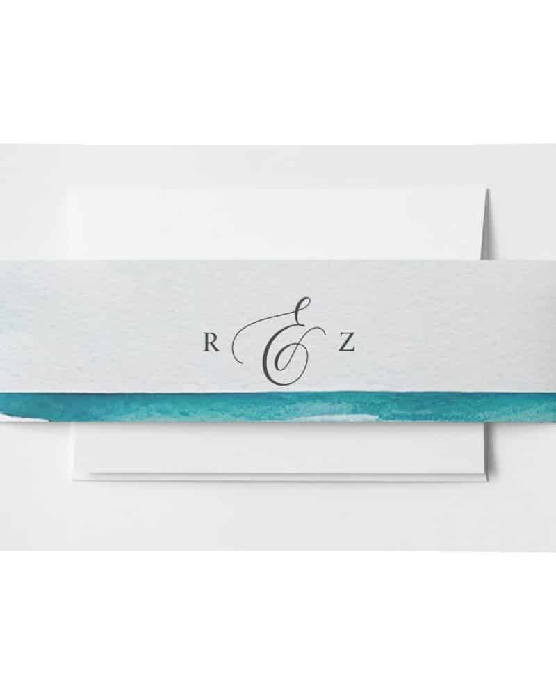 Wedding invitation with teal watercolor band and monogram.