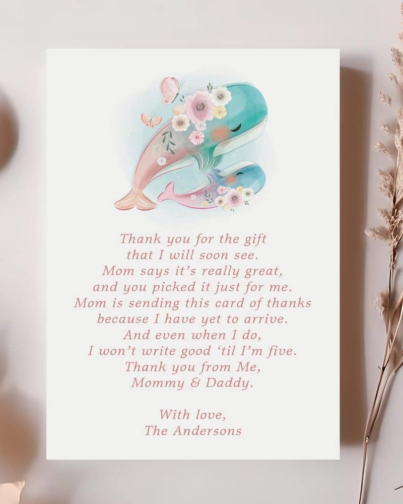 Thank you card featuring two whales adorned with flowers, a thank you message from a baby to the gift giver, and signed by the baby's parents.