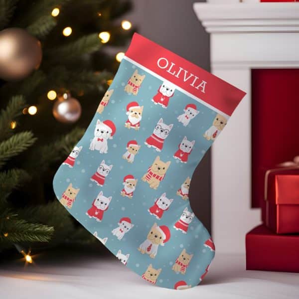 Personalized Christmas Stocking With A Light Blue Background And A Repeating Pattern Of French Bulldogs In Festive Attire. The Name Olivia Is At The Top.