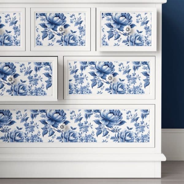 White Dresser With Blue And White Floral Drawer Liners.