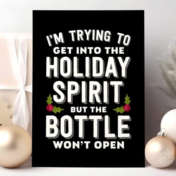 A Black Sign With White Text That Says, Im Trying To Get Into The Holiday Spirit But The Bottle Wont Open. Holly With Red Berries Is On Either Side Of The Word Spirit.