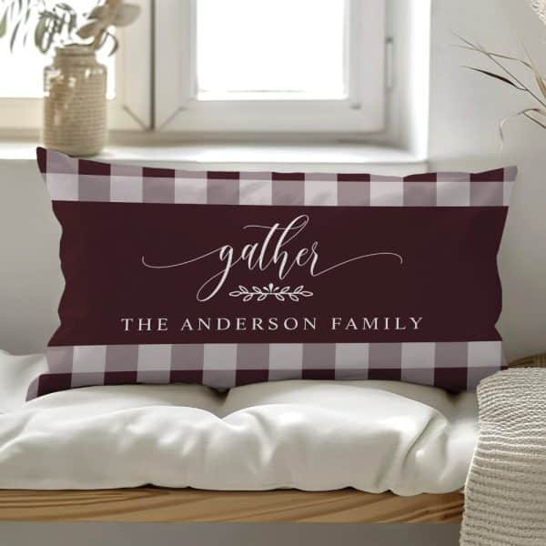 Rectangular Burgundy And Gray Gingham Pillow With The Word Gather And The Anderson Family Name.