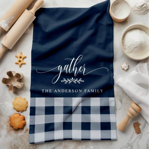 Navy Blue And White Checkered Kitchen Towel With The Word Gather And The Anderson Family Printed On It.