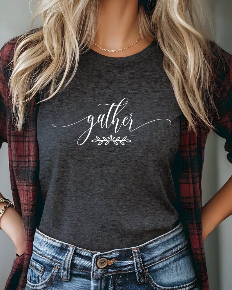 Woman wearing a dark gray t-shirt with the word gather in white script.