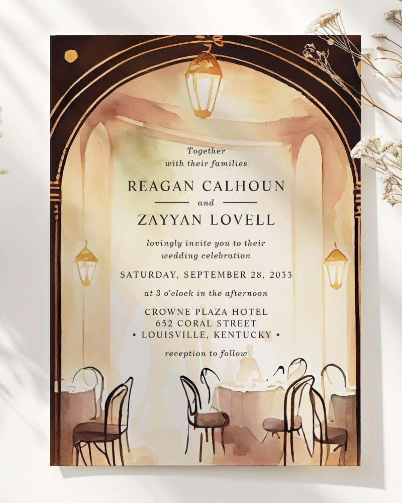 Wedding invitation featuring a watercolor painting of an arched entryway to a restaurant with tables set for a reception.