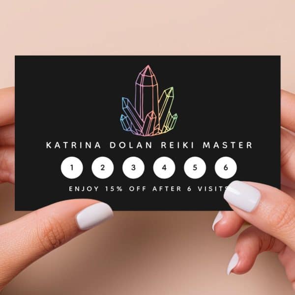 Black Loyalty Card Featuring A Rainbow Crystal Graphic And Katrina Dolan Reiki Master Text; Six Circles For Tracking Visits, With A 15% Discount After Six Visits.
