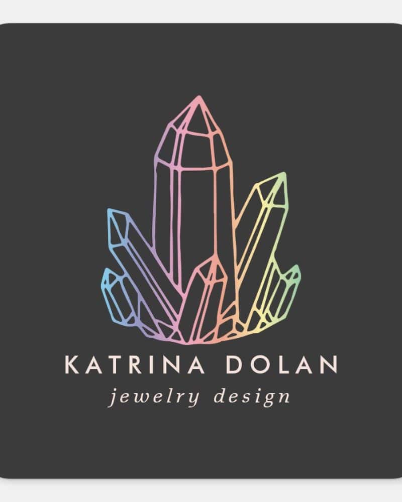 A logo featuring a cluster of pastel-colored crystals, with the text Katrina Dolan jewelry design below.