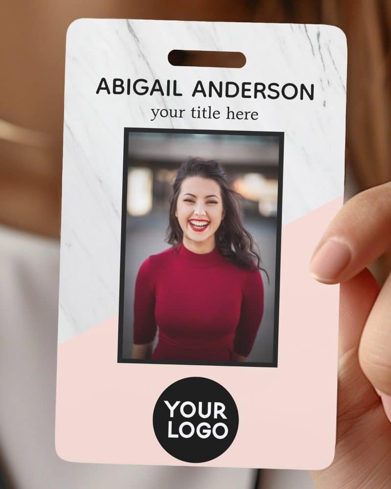 A pink and white marble ID card with a woman's photo, her name, title placeholder, and a logo placeholder.