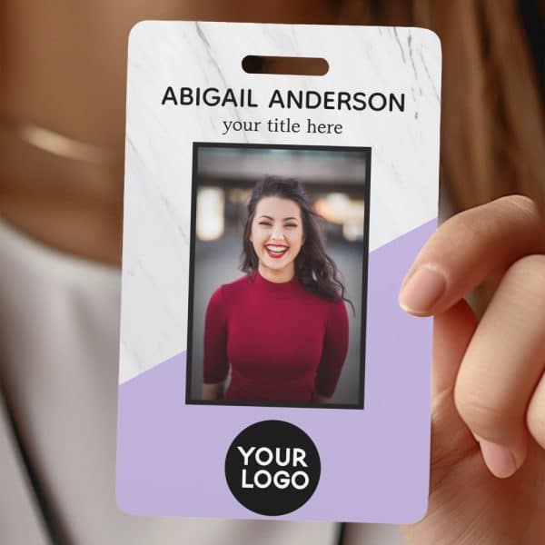 A Marble And Lavender Id Card With A Photo Of A Smiling Woman, Her Name, A Placeholder For A Title, And A Space For A Logo.